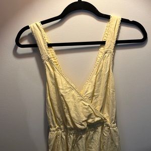 Pale yellow cross-back and low v maxi dress.